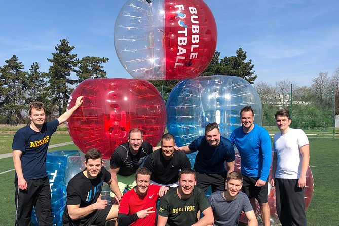 Bubble football - The game setup: knee pads, bubble balls, and referee control