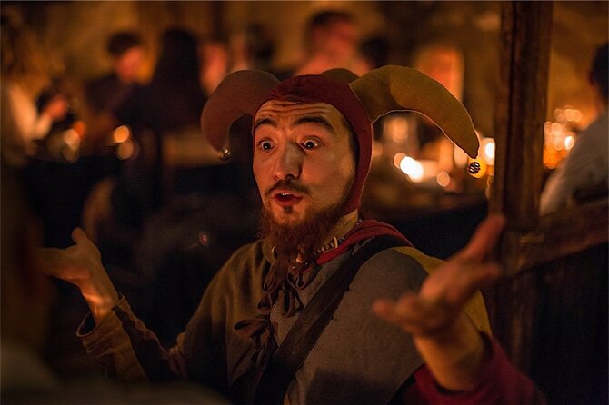Prague 5 Courses Medieval Dinner and Live Performances - Seating and lighting: communal tables, phone light, and seatmate planning