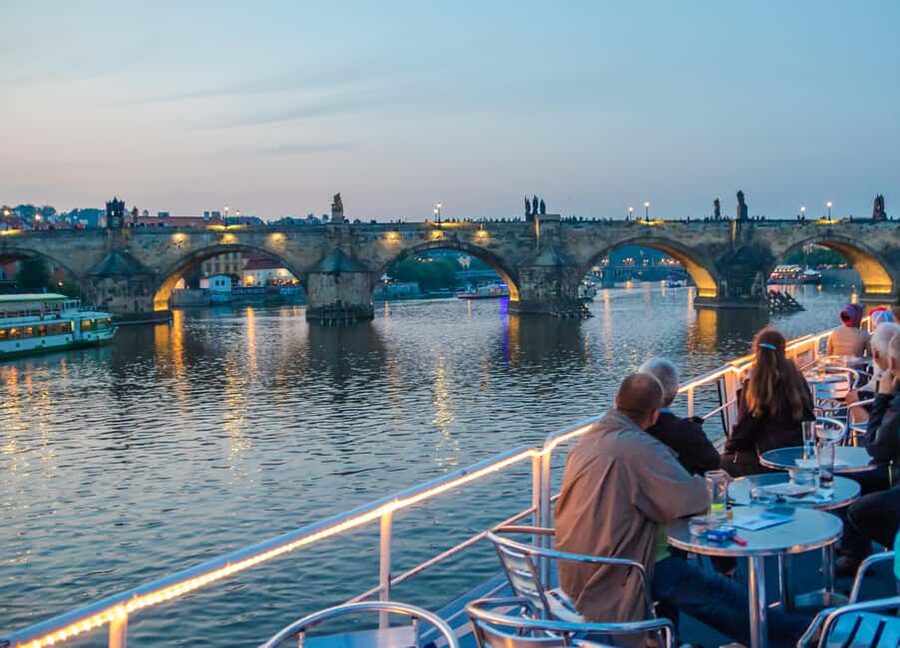 Prague: Dinner Cruise with Hotel Pickup and Drop-off - Boarding the Air-Conditioned Boat and Getting Set Up