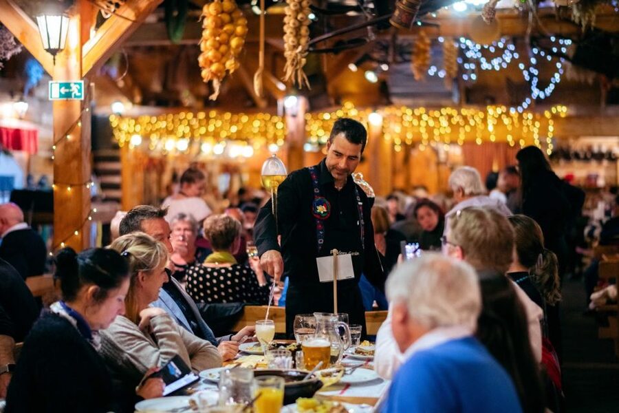 Prague: Evening Folklore Garden Party with Traditional Menu - Folk costumes, games, and audience participation before the big show