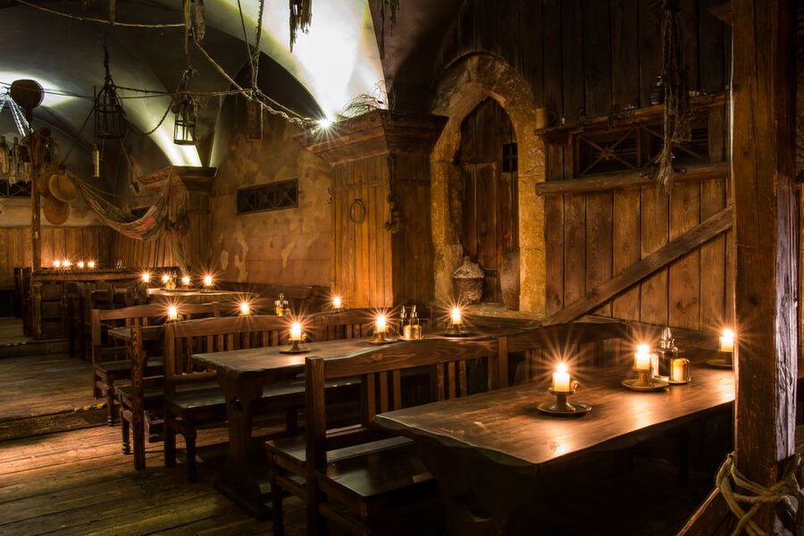 Prague: Medieval Dinner with Transfers - Entering a Medieval Cellar Dinner Show in Prague
