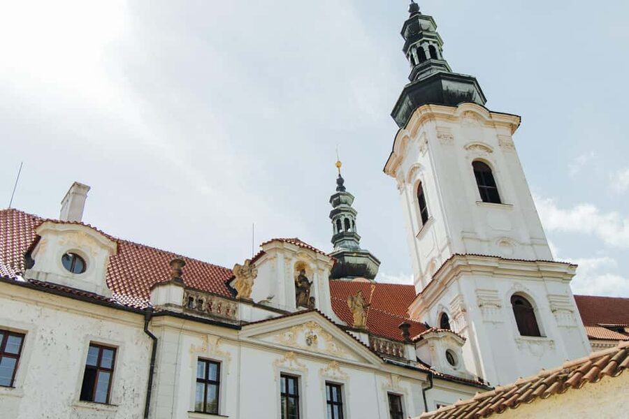Prague Most Beautiful Walk: Prague Castle & Monastery Views - Entering Prague Castle the smart way, focusing on the exteriors