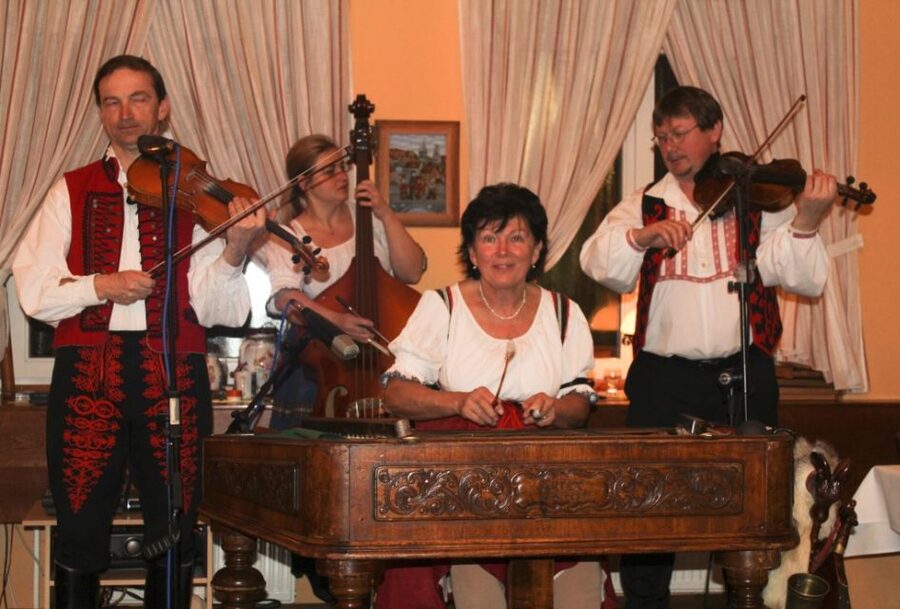 Prague: Traditional Folklore Evening with Dinner & Music - Entering the Prague wine cellar where folk music sets the pace