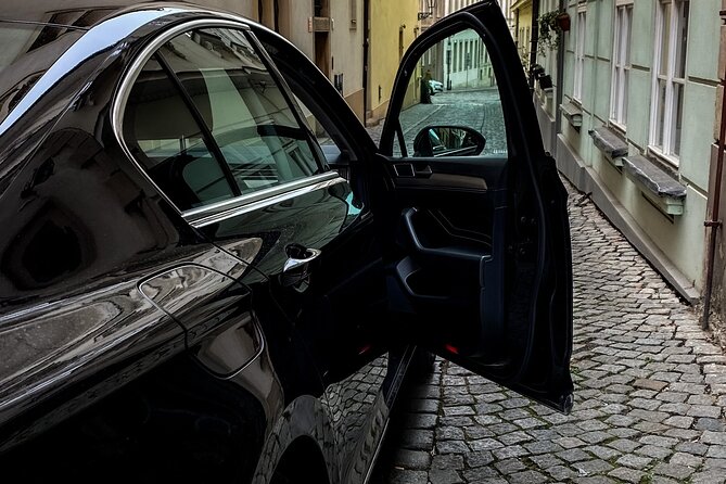 Private ARRIVAL Transfer by LIMOUSINE 3+1pax - Meeting your driver at arrivals, with a real paper sign